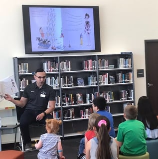 Seguin ISD Dr. Gutierrez reading to children