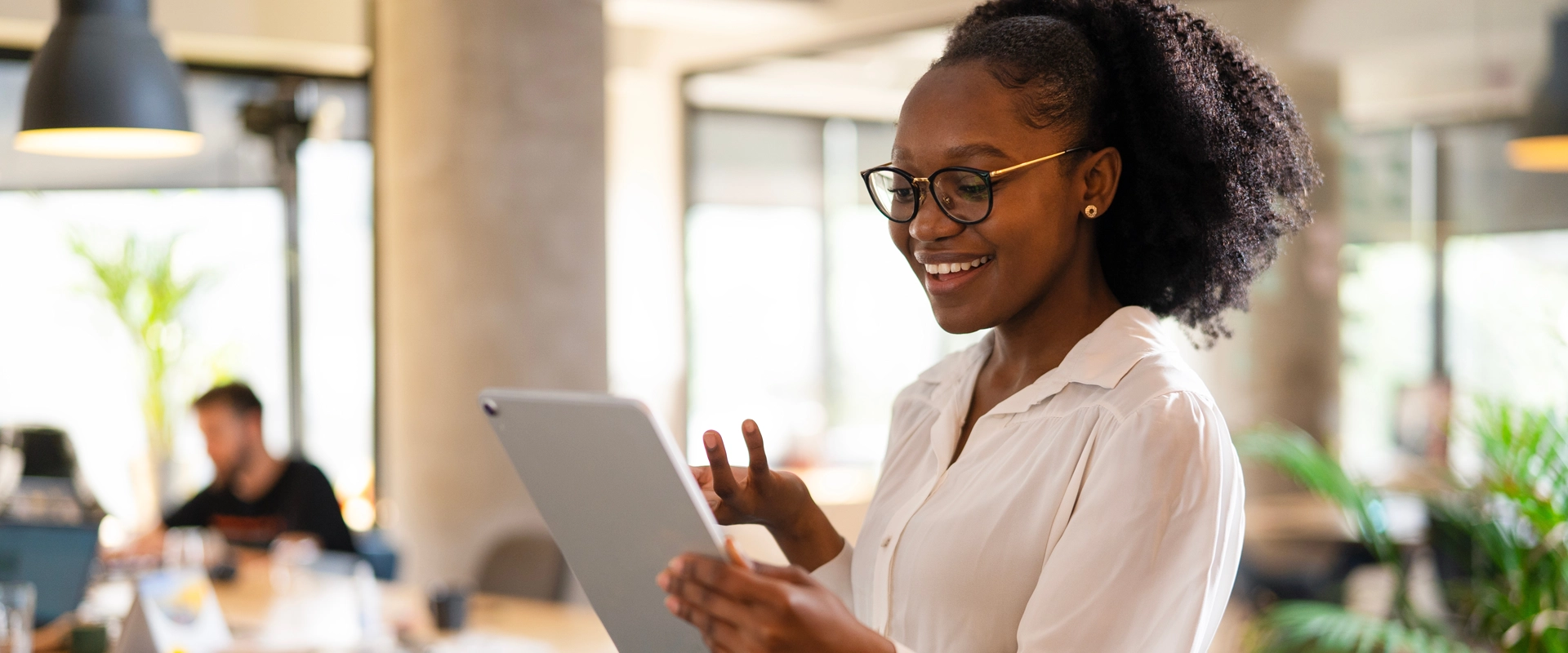 Woman smiling with ipad